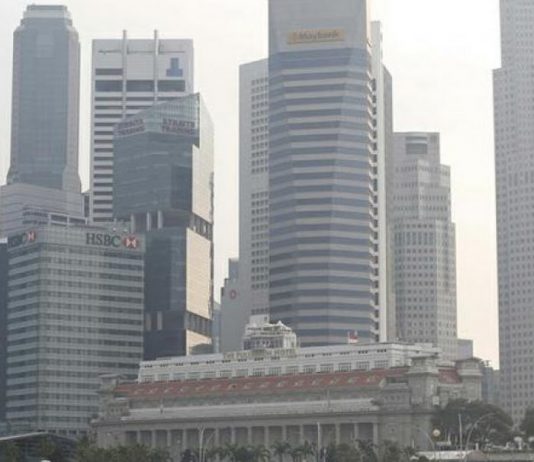 Singapore economy shrinks in warning for global trade – Malay Mail